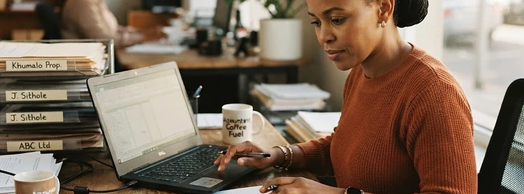 Accounting firm owner reviewing a confidential practice-for-sale listing in South Africa