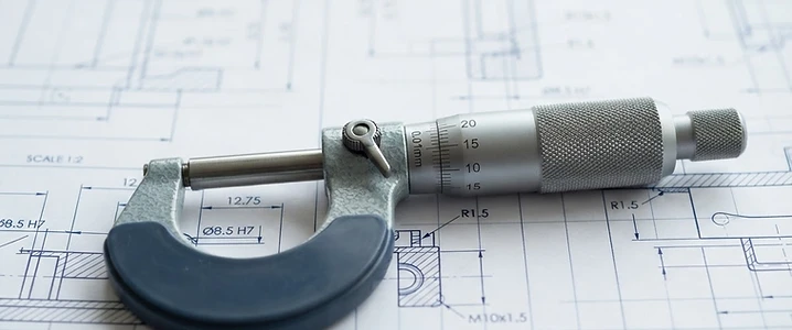 Precision measurement tool on a technical blueprint
