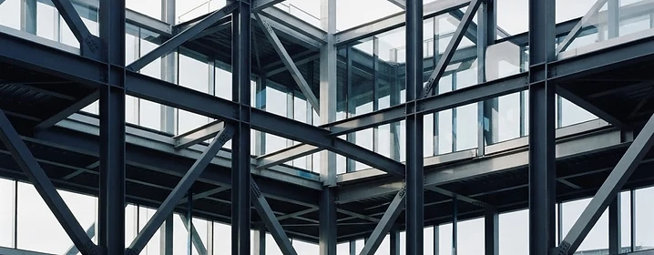 Architectural beams and glass symbolizing a foundation