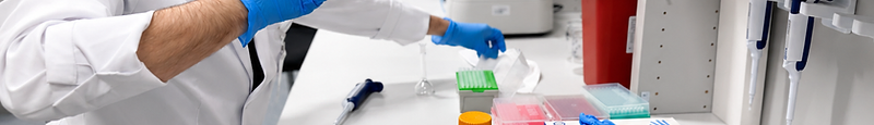 Cadence technician examining a sample tube