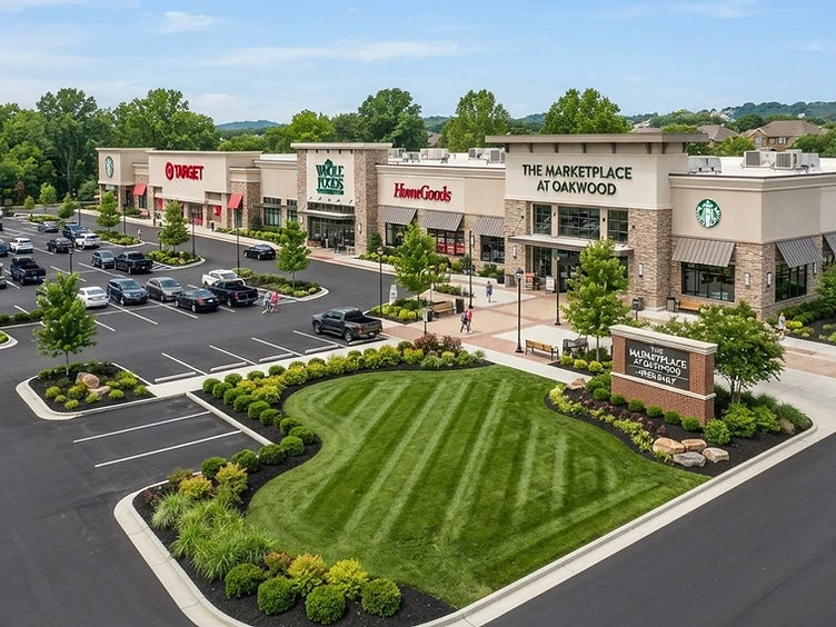 Large commercial retail property with maintained landscaping and clean parking lot