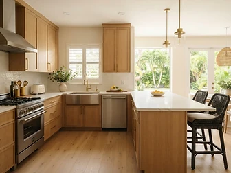 Remodeled South Florida kitchen with new cabinetry, stone countertops and island lighting