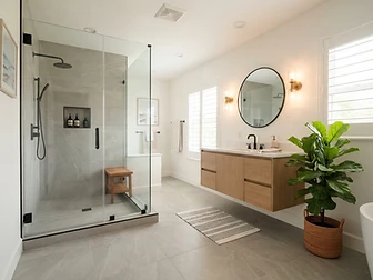 Renovated South Florida bathroom with walk-in shower, new vanity and tile flooring