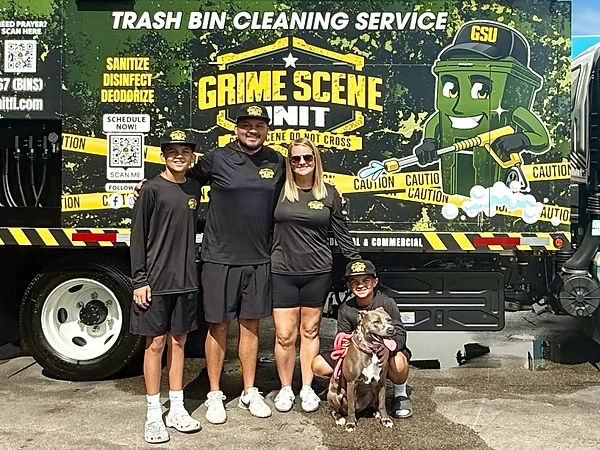 The Grime Scene Unit family in front of their branded sanitation truck