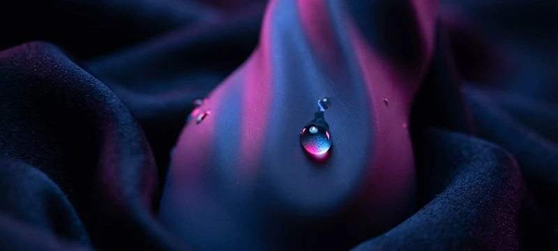 Macro study of body-safe silicone in pink and cobalt light