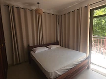 Double bedroom — wooden frame with woven pendant light