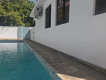 Swimming pool — close-up of the tiled pool beside the villa