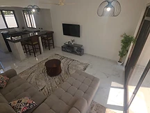 Living room — high-angle view of lounge and kitchen