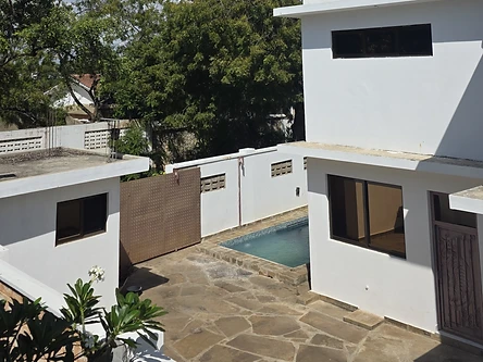 Swimming pool — villa exterior and turquoise pool in the courtyard