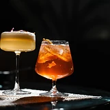 Two cocktails on the bar
