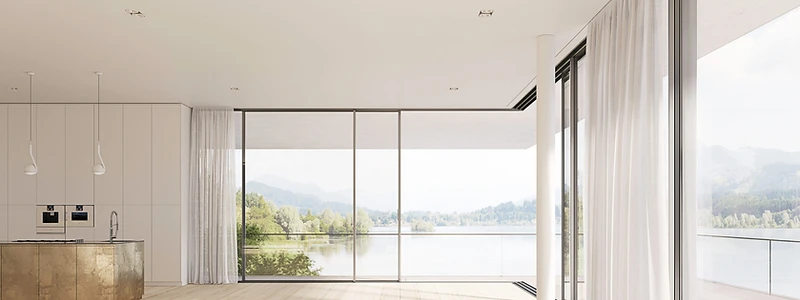 Minimal-frame sliding doors opening onto a bright architectural space