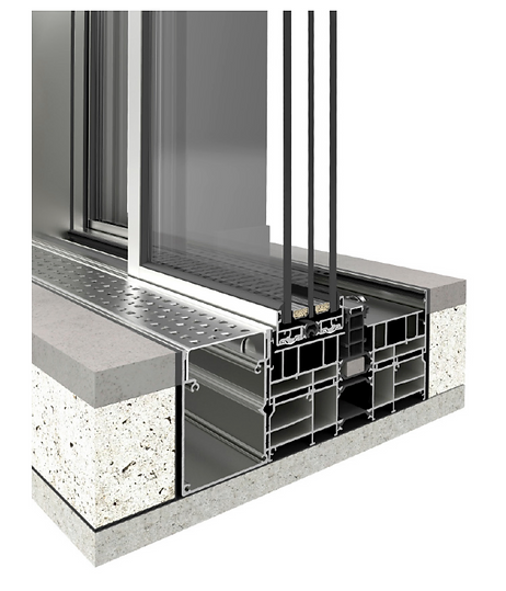 Flush threshold & drainage detail — extruded aluminium base frame with glazing unit and a perforated drainage cover set flush into the floor