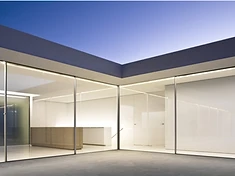 Detail of a slim sliding door frame and flush floor threshold