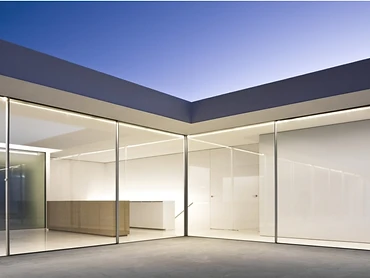 Detail of a slim sliding door frame and flush floor threshold
