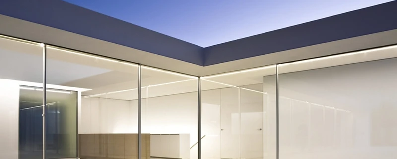 Detail of a slim sliding door frame and flush floor threshold