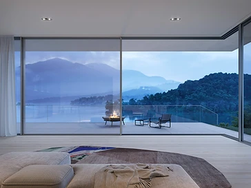 Minimal-frame sliding doors opening a living space onto a terrace