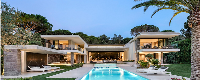 Triple-glazed minimal-frame sliding door in a high-performance home