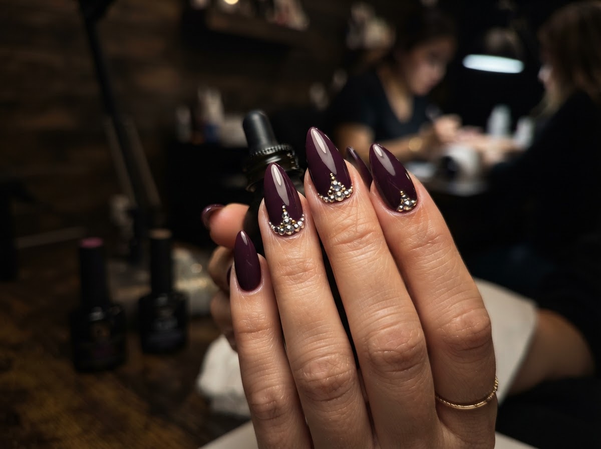 Deep plum stiletto nails with rhinestones September 2026