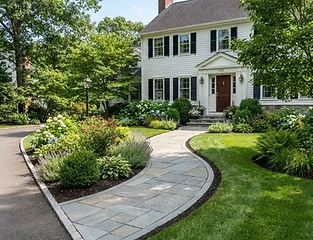 Curved stone paver walkway through front yard
