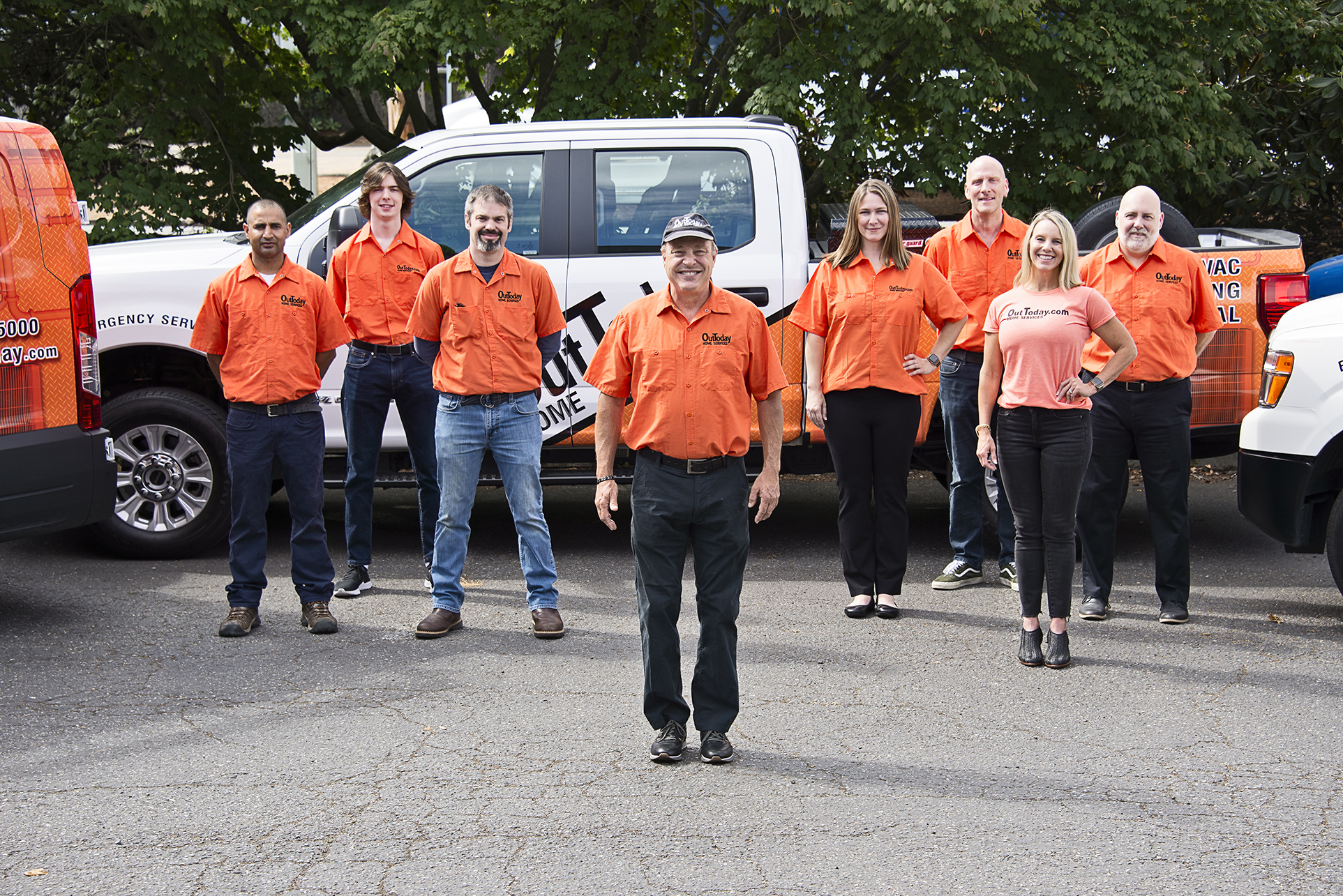 The OutToday Home Services team with the service fleet