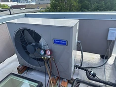 Rooftop American Standard condenser with manifold gauges attached for service