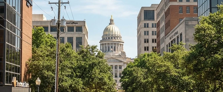 Downtown Jackson, Mississippi with the capitol dome rising above the trees
