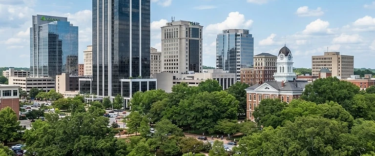 Downtown Huntsville, Alabama skyline with glass towers above the oak trees