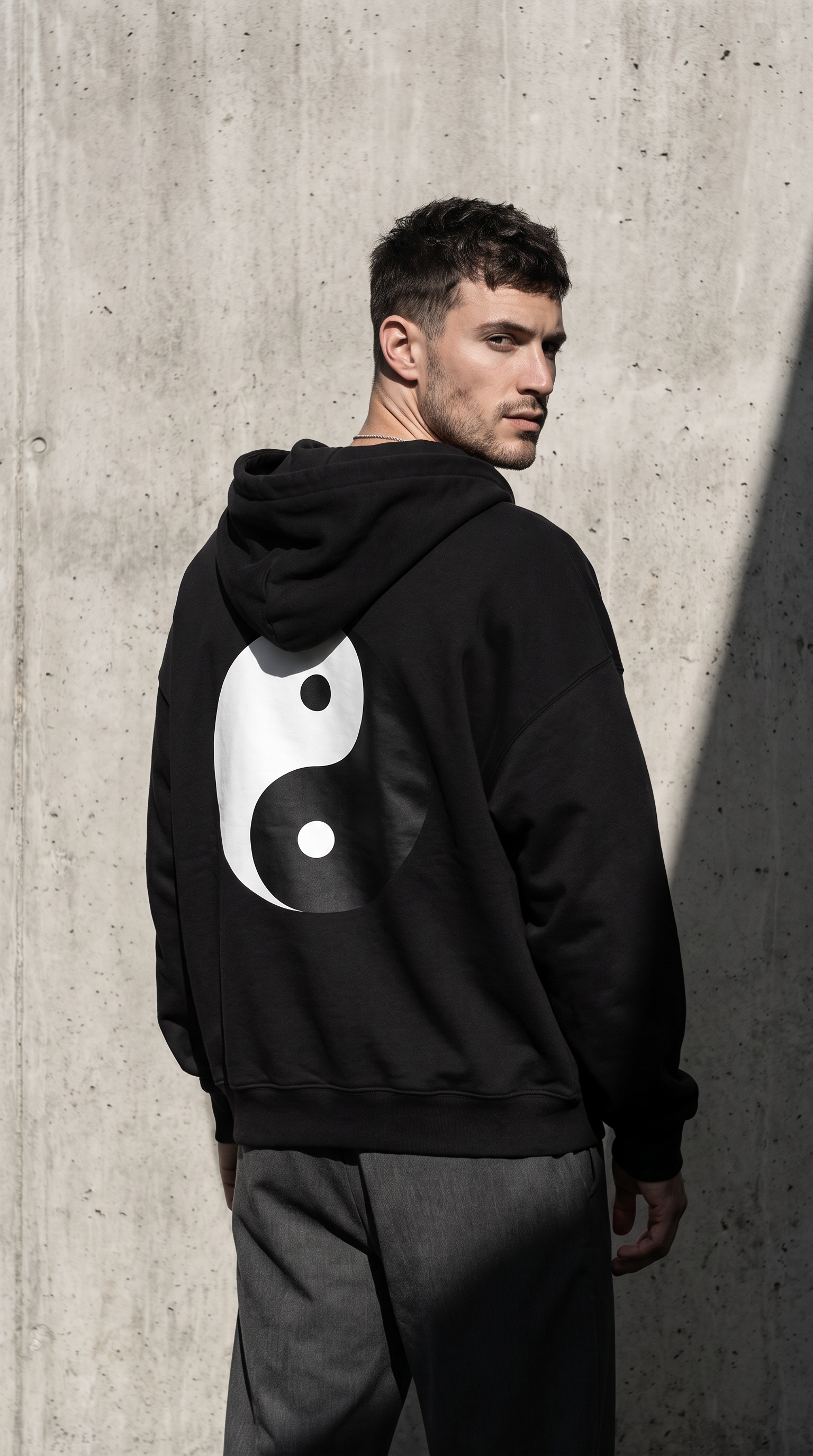 Man wearing MISO Yin Yang hoodie