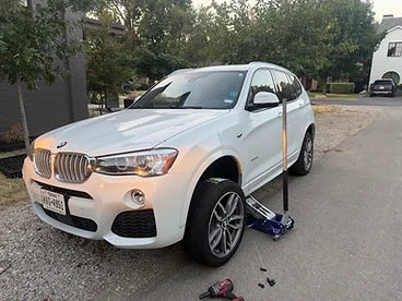 Passenger tire replacement — BMW X3 on the roadside