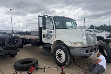 Commercial fleet tire service — Chamberlin Roofing truck