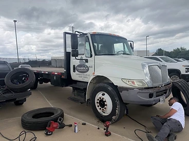 Commercial fleet tire service — Chamberlin Roofing truck