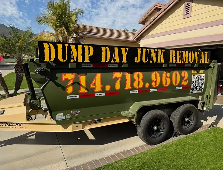 Dump Day 12-yard dump trailer parked on a residential driveway
