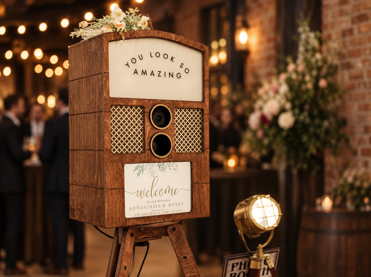 Close-up of a handcrafted vintage walnut photo booth with brass hardware