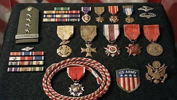 Realistic illustration of the military medals and badges awarded to Dwight Eisenhower, including Legion of Merit (Allied Degree of Chief Commander), Fourragère de la Légion d'Honneur, Order of the Patriotic War (Allied Presentations), Inter-Allied Victory Medal, Croix de Guerre with Allied Palms, Order of the British Empire (Military Division - Allied Conferred), Inter-Allied Commemorative Medal of the Federation of Interallied Combatants, shown against a light Allied Powers flag background. AI-generated illustration, not an authentic photograph.
