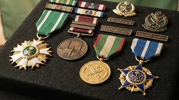 Realistic illustration of the military medals and badges awarded to Prince Sultan bin Abdulaziz, including Order of King Abdulaziz, Medal of the Holy Mosque Reserve, Medal of Leadership, Order of King Faisal, shown against a light Saudi Arabia flag background. AI-generated illustration, not an authentic photograph.