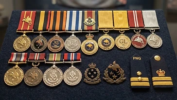 Realistic illustration of the military medals and badges awarded to Jerry Singirok, including National Logohu Medal, Papua New Guinea Independence Medal, Papua New Guinea 10th Independence Anniversary Medal, Papua New Guinea 30th Independence Anniversary Medal, Papua New Guinea Defence Force 50th Anniversary Medal, Officer of the Order of Logohu, Grand Companion of the Order of Logohu, Distinguished Military Service Medal, Member of the Order of Logohu, shown against a light Papua New Guinea flag background. AI-generated illustration, not an authentic photograph.