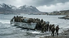 British amphibious landing craft carrying Royal Marines approaches the rocky shore of San Carlos Water during Operation Sutton, Falklands War, 1982.