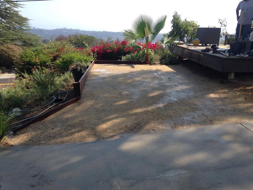 Hillside yard after regrading and edging by Reyes Gardening Services
