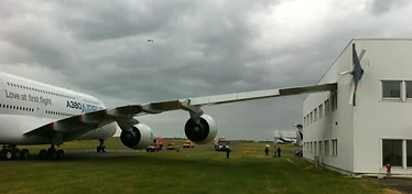 A380 wing strike on airport building