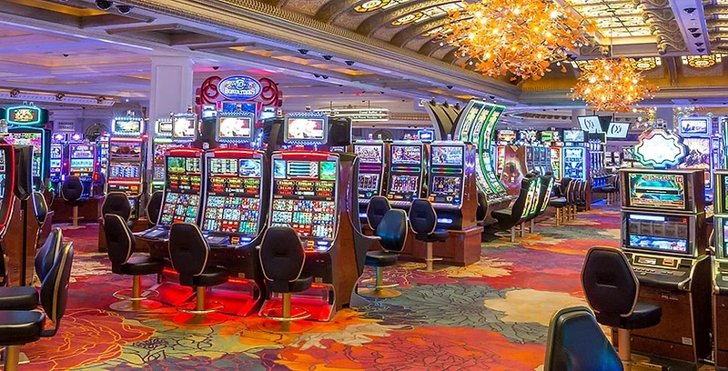 The brightly lit gaming floor at Niagara Fallsview Casino with rows of slot machines