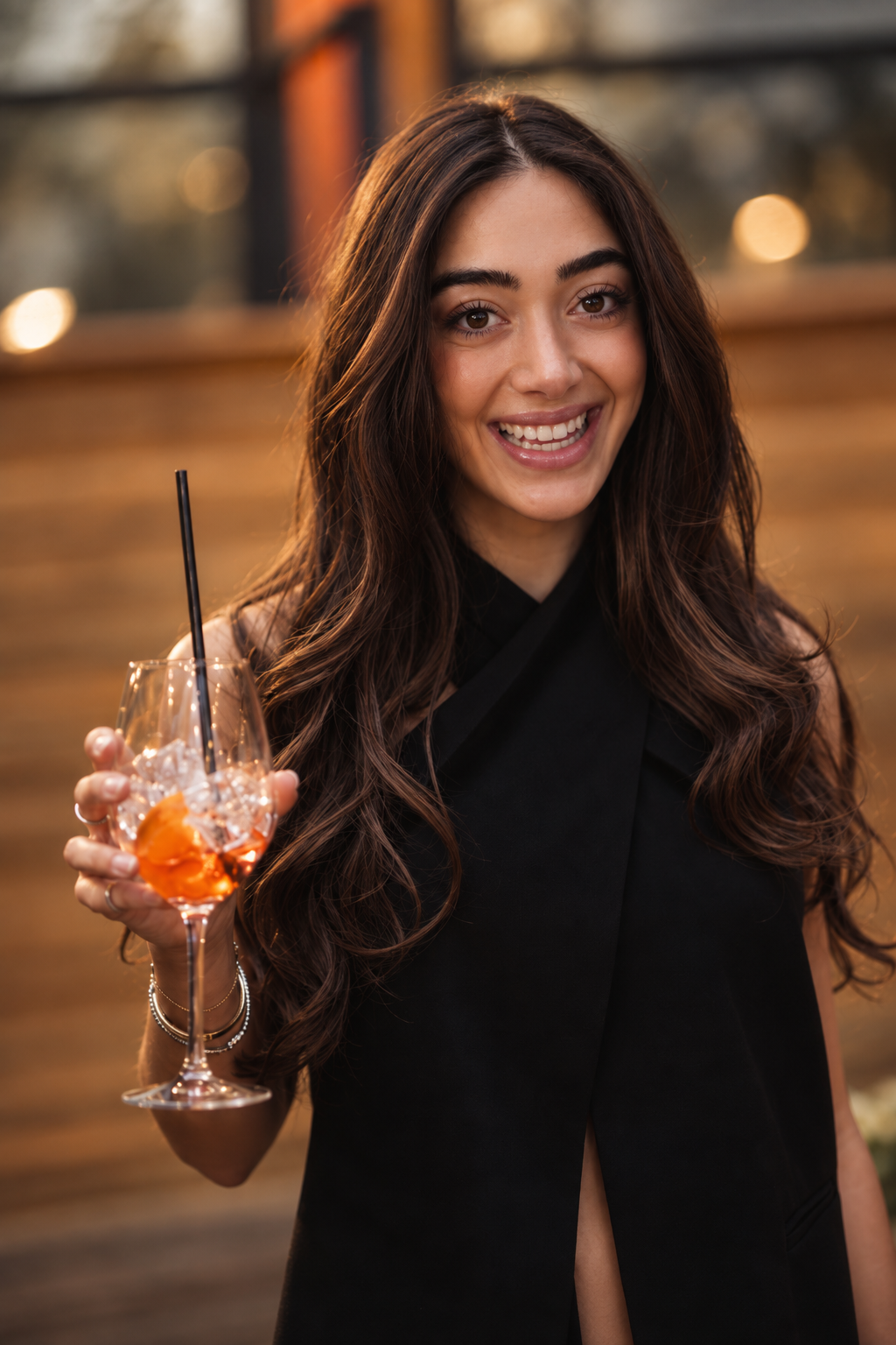 Event photograph of a toast under golden-hour lighting