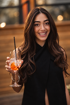 Event photograph of a toast under golden-hour lighting
