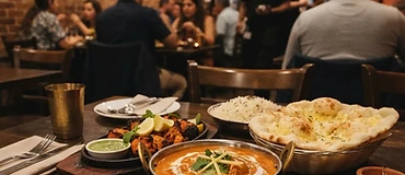 A beautifully plated butter chicken and fresh naan bread served at Jaggi's Indian Eatery in Seven Hills.