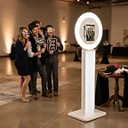 Guests laughing at the photo booth