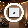 The booth&rsquo;s glowing ring light and screen