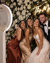 A couple laughing in the photo booth