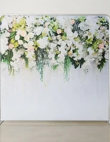 A cascading floral backdrop in soft whites, cream and greenery