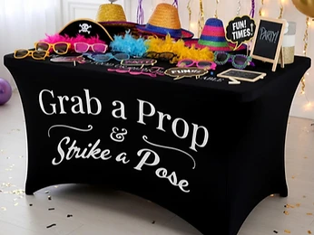 Guests trying on props at the photo booth