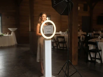 The photo booth glowing under premium event lighting