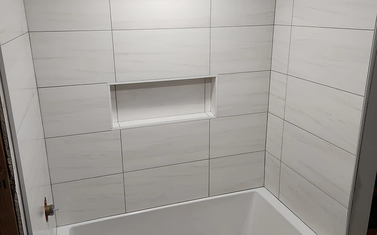 White Marble Tub Surround — luxury shower tile installation by Lotto Custom Tile